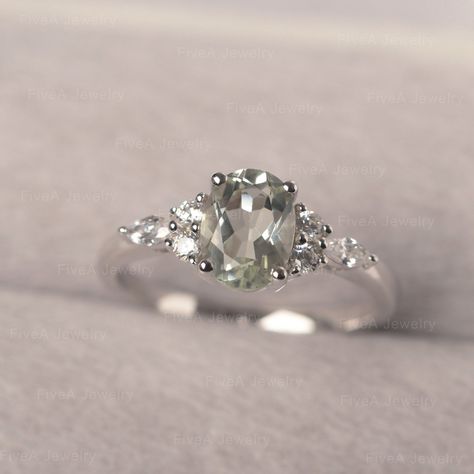 * The delicate ring displays green amethyst as main stone. The cluster side stones make the ring similar to the blooming flower . For who wearing this special & delicate ring, will shine like a goddess. ◆ Production Description: Main stone Type: Green Amethyst Main Stone Shape: Oval Cut Main Stone Size: 6*8mm (1.14ct) Side stone: CZ Metal: 925 Sterling silver - Other options available in the drop down menu ◆ Customization: √Free for Add Engraving √Other Metal Type Available √Other Gemstones Silver Green Ring, Gemstone Engagement Rings Silver, Green Amethyst Engagement Ring, Green Engagement Rings, Real Green, Cute Engagement Rings, Green Amethyst Ring, Silver Engagement Ring, Engagement Ring For Women