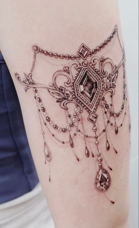 Back Jewelry Tattoo, Tattoos That Look Like Jewelry, Black And Gray Jewel Tattoo, Thigh Jewelry Tattoo, Chandelier Tattoos For Women Arm, Jewelry Tattoo Designs Arm, Vintage Jewelry Tattoo, Necklace Tattoos Women, Shoulder Jewelry Tattoo