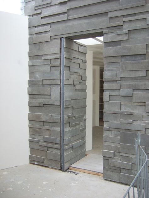 who doesn't want a hidden doorway? this design of a 'secret' threshold allows the bluestone wall to become a seamless feature through out the house. Hidden Door Exterior, Hidden Front Door Entrance, Hidden Exterior Door, Speakeasy Doors, Carport Door, Camouflage Door, Patio Mexicano, Hidden Door Design, Secret Door Ideas