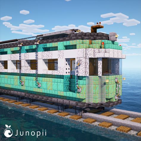 Minecraft build of a turquoise colored Japanese retro train car in the middle of the ocean. Totoro Minecraft Build, Minecraft Train Tunnel, Minecraft Train Design, Minecraft Ghibli Builds, Minecraft Steam Train, Minecraft Monorail, Minecraft Caravan, Tunnel Minecraft, Studio Ghibli Minecraft