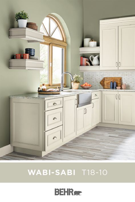 There’s nothing like a pastel wall color to draw in natural light, making your home feel open and airy. That’s why we’re loving Behr Paint in Wabi-Sabi, featured in this modern farmhouse kitchen. Click below for full color details to learn more. Neutral Kitchen Paint Colors, Light Green Kitchen, Popular Kitchen Colors, Green Kitchen Walls, Traditional Style Kitchen, Light Green Walls, Paint For Kitchen Walls, Kitchen Wall Colors, Kitchen Paint Colors