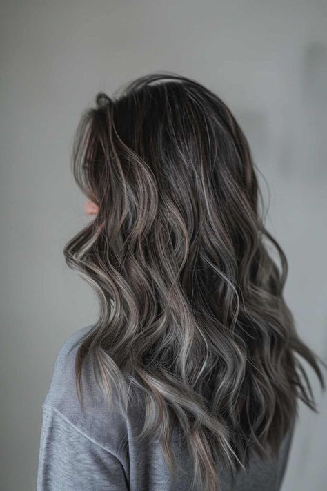 Save this pin for a stunning long wavy brunette with ash grey highlights! Feeling bored with your current hair color? Tap to see how these gorgeous highlights can add depth and dimension to your look, making you feel fabulous! Grey Hair Color Ideas For Brunettes, Dark Brunette Balayage Hair Ashy, Ash Grey Highlights On Brown Hair, Dark Hair Grey Coverage Ideas, Grey Babylights On Dark Hair, Grey Brown Hair Balayage, Dimensional Ashy Brunette, Brunette Grey Hair, Adding Dimension To Dark Brown Hair