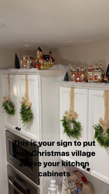 Christmas Village On Cabinets, Christmas Village Over Kitchen Cabinets, Village Above Cabinets, Christmas Village Above Cabinets, Christmas Village Cabinet Display, Christmas Village Kitchen Cabinets, Christmas Kitchen Cabinet Decor Above, Above Cabinet Decor Kitchen Christmas, Christmas Village Above Kitchen Cabinets