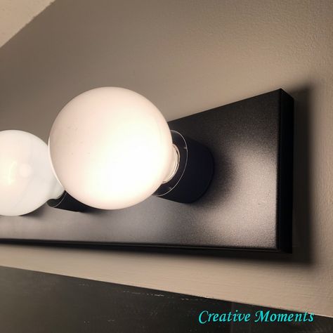 Spray Paint Vanity Light, Paint Bathroom Light Fixture, Spray Painted Light Fixture, Updating Bathroom Light Fixtures, How To Paint Light Fixtures, Spray Paint Bathroom Light Fixtures, Spray Paint Light Fixture Bathroom, Painting Bathroom Light Fixtures, Light Fixture Update Diy