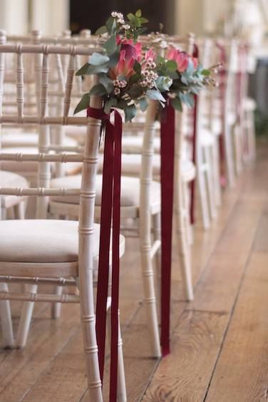 Wedding florist in the Cotswolds and surrounding areas Burgundy Wedding Chair Decor, Burgundy Wedding Aisle, Burgundy Wedding Decorations, Gold And Burgundy Wedding, Burgundy Wedding Theme, Luxury Wedding Flowers, Aisle Flowers, Wedding Chair Decorations, Winter Wedding Decorations