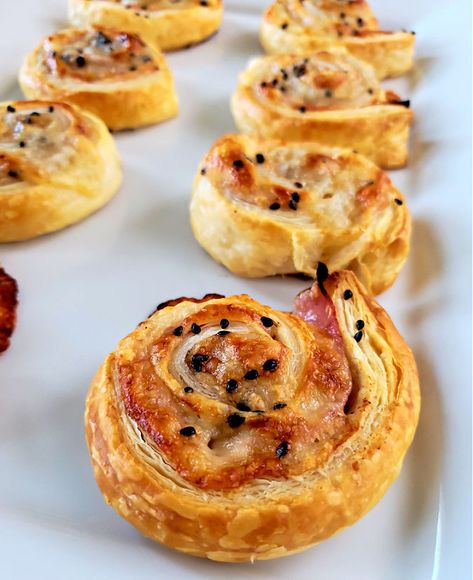 Roll Ups puff pastry pinwheels appetizers with ham and cheese on a white platter Ham Cheese Puff Pastry Pinwheels, Puff Pastry Appetizers Easy, Ham Appetizers, Ham Cheese Puff Pastry, Pinwheels Appetizers, Pastry Pinwheels, Roast Beef And Cheddar, Ham And Cheese Roll Ups, Puff Pastry Pinwheels