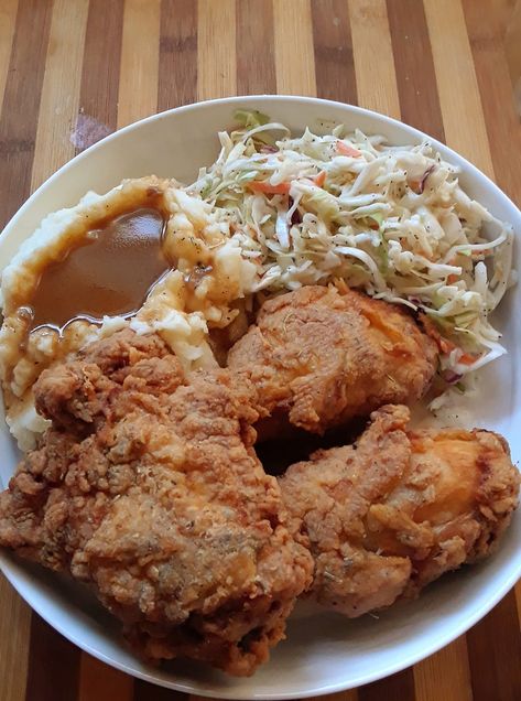 FacebookPinEmail Southern Supper Bliss: Fried Chicken, Mash, and Coleslaw What a delightful evening! 2 crispy fried chicken legs and 1 juicy thigh!! Mash Potato with Gravy! And don’t forget some coleslaw!   Southern Supper Bliss: Fried Chicken, Mash, and Coleslaw recipe Ingredients: 3 chicken pieces One egg 1 tablespoon of hot sauce Half a teaspoon... Chicken Mash, Kfc Mashed Potatoes, Fried Chicken Dinner, Apple Dumpling Recipe, Fried Chicken Legs, Mash Potato, Comfort Food Chicken, Buttered Vegetables, Chicken Leg Recipes