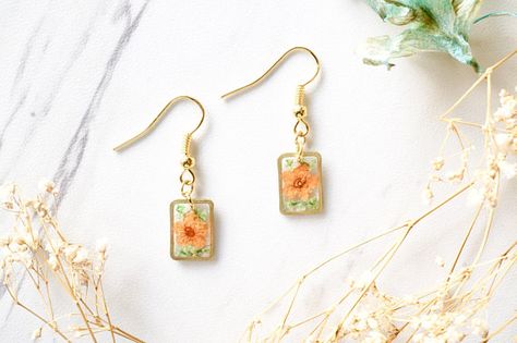 Real Dried Flowers and Resin Earrings Gold Rectangle Drops in Diy Resin Earrings, Flower Resin Jewelry, Beaded Clutch, Orange And Green, Resin Earrings, Metal Flowers, Brass Frame, Lovely Jewellery, Bridesmaid Earrings