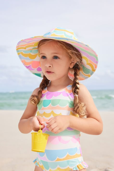 Keep them protected on the beach with our cute swim hat. Designed with a wide brim and made from a lightweight material, this summer staple will be a firm favourite for your little one. Matching swimwear is also available. Main 82% Recycled polyester, 18% Elastane. Lining 92% Recycled polyester, 8% Elastane. Playful Cotton Beach Hat, Childrens Swimwear, One-size Multicolor Beach Hat, Swimwear Inspiration, Childrens Swimwear Beach, Kids Beach Towel, Kids Swim, Kids Beach Towels, Matching Swimwear