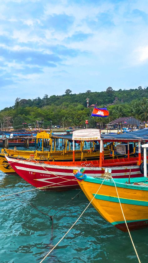 Colourful boats on turquoise blue waters in front of tropical island. Backpacking Cambodia, Cambodia Koh Rong, Cambodia Travel Aesthetic, Backpacking Southeast Asia Aesthetic, Koh Rong Cambodia, Backpacking Asia Aesthetic, South East Asia Travel Aesthetic, Cambodia Aesthetic, South East Asia Aesthetic