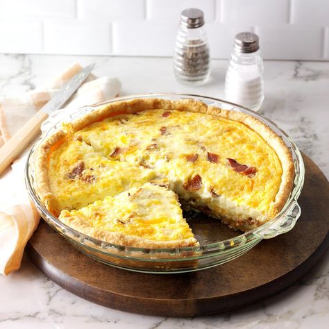 Breakfast Quiche Recipe -I enjoy preparing hearty country breakfasts for the guests at my bed-and-breakfast. This fluffy golden pie, which has lots of cheese and bacon, is a most satisfying entree.—Mark Clark, Twin Mountain, New Hampshire Best Quiche Recipes, Bacon And Cheese Quiche, Christmas Breakfast Casserole, Quiche Lorraine Recipe, Breakfast Quiche Recipes, Bacon Quiche, Quiche Recipes Easy, Cheese Quiche, Breakfast Quiche