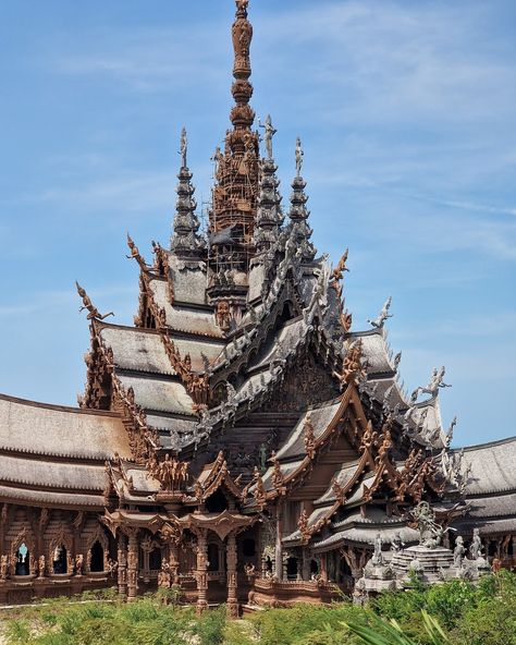 Thailand's remarkable Sanctuary of Truth Museum: ALL wood and NO nails! Towering over the shores of Pattaya, this Thai temple is a marvel of intricate wooden architecture that left us completely awestruck. This unfinished museum, the brainchild of Thai businessman Lek Viriyaphan, is a unique blend of temple and castle, inspired by Ayutthaya Kingdom, Buddhist, and Hindu philosophies. The Sanctuary's construction began in 1981, and despite being unfinished, it has become an iconic landmark of ... Thai Temple Architecture, Sanctuary Of Truth, Thailand Architecture, Thailand Temple, Thai Architecture, Thailand Country, Thai Temple, Thailand Art, Wooden Architecture