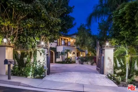 19029 Ashurst Ln, Tarzana, CA 91356 | realtor.com® Tarzana California, Stone Kitchen Island, Contemporary Mediterranean, Patio Fireplace, Wood Beam Ceiling, Elegant Dining Room, Solar Heating, Mediterranean Home, Entrance Gates