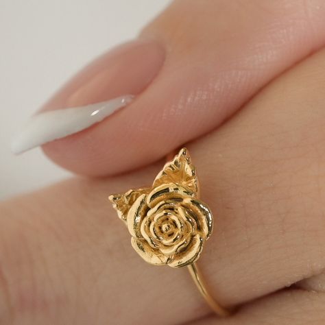 Embrace the beauty of nature with our 3D-printed Rose Ring. This intricately crafted piece captures the essence of a blooming rose, making it a stunning accessory for flower enthusiasts and nature lovers alike. Whether as a gift or a treat for yourself, this delicate and dainty ring is sure to make a lasting impression. Size: Varies by size about 2.5-3.5 tall and 1.2-1.3 thick Adjustable Elegant Rings With Roses, Adjustable Rose Design Flower Ring, Delicate Rose Flower Shaped Jewelry, Elegant Adjustable Rose Flower Ring, Adjustable Gold Flower Ring Nature-inspired, Rose Ring Flower, Rose Making, Rose Accessories, Rose Flower Ring