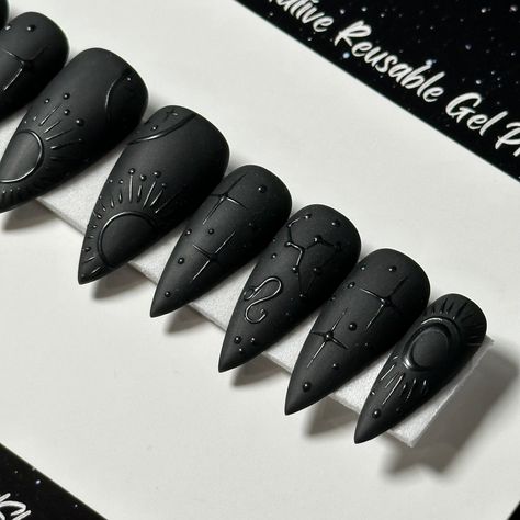 Welcome to LD Nails! 🖤 One set of 10 REUSABLE Press On Nails 🖤 🖤 Made to order in your shape & size 🖤 🖤 Black on Black: Zodiac. Velvet Matte black press on nails with glossy black zodiac detailing ♌️ ♊️ Leo & Gemini are pictured, Please leave a note with your sign in the personalization box, so I can customize it just for you! 🖤 Purchase INCLUDES an application kit! It consists of: 🖤 detailed application & removal instructions 🖤 a sealed and sanitary mani kit (100/180 file, buffer block, Matte Black Skeleton Nails, Punk Press On Nails, Shiny On Matte Nails, Black Nails Press On, Wedding Black Nails For Bride, Celestial Black Nails, Matte Black Witchy Nails, Zodiac Nails Designs Leo, Planchette Nail Art