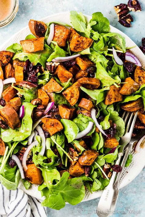 SAVE FOR LATER! This sweet potato salad is perfect for fall. It's made with roasted sweet potatoes, arugula or spinach, toasted pecans, cranberries, and a delicious brown butter vinaigrette. It's irresistible! #theendlessmeal #sweetpotatoes #yams #sweetpotatosalad #salad #saladrecipes #sweetpotatorecipes #fallrecipes #refinedsugarfree #thanksgiving #autunn #orange #friendsgiving #healthyrecipes #paleo #dairyfree #vegetarian #vegetarianrecipes Potato Recipes Salad, Yam Salad, Brown Butter Vinaigrette, Salad Dinners, Perfect Baked Chicken Breast, Perfect Baked Chicken, Filling Salad Recipes, Light Salads, Sweet Potato Salad Recipe