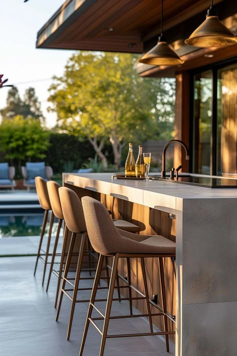 Backyard outdoor kitchen bar with modern outdoor bar stools next to pool Outdoor Barstool Ideas, Outdoor Island Ideas, Bar Counter Outdoor Design, Outdoor Bar Styling, Outdoor Counter Bar, Outdoor Bar Area Ideas, Bar Outside Ideas Patio, Boho Outdoor Kitchen, Outdoor Bar Stools With Backs