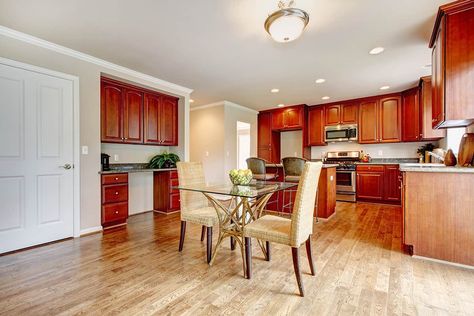 Hardwood Floors With Cherry Cabinets, Flooring With Cherry Kitchen Cabinets, Wood Floor With Cherry Cabinets, Red Cherry Cabinets Kitchen, Wood Floors With Cherry Cabinets, Luxury Vinyl Plank Flooring Kitchen With Cherry Cabinets, Cherry Kitchen Cabinets With Wood Floors, Kitchen Cabinets With Oak Floors, Flooring With Cherry Cabinets