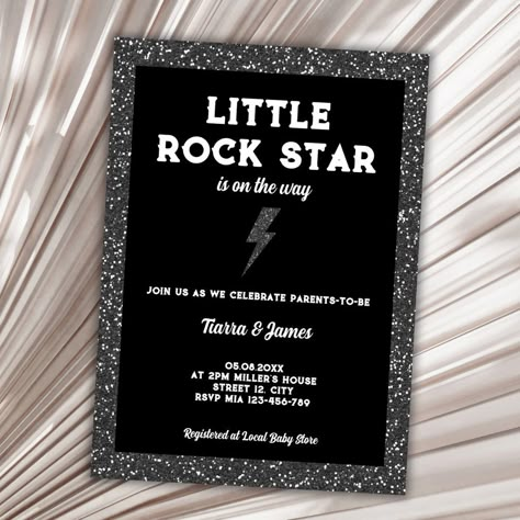 Looking for the perfect baby shower invitation to rock your world? This rock and roll theme baby shower invitation featuring a black glitter background and glitter flash, is sure to catch your eye. With the fun and playful sentence "little rockstar is on the way", your guests will know they're in for a party like no other. This invitation is perfect for parents who want to celebrate their future little musician with an edgy and exciting theme. Order now and get ready to rock! Rock Gender Reveal Ideas, Rock And Roll Engagement Party, Music Themed Gender Reveal, Rock N Roll Gender Reveal, Rockstar Baby Shower Ideas, Punk Rock Baby Shower Ideas, Rock A Bye Baby Shower Theme, Rock And Roll Invitations, Born To Rock Baby Shower Ideas