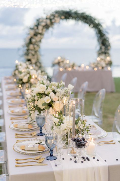 Picture this: A lush circular ceremony arch of white roses on the beaches of Phuket and an intimate outdoor wedding reception under twinkling lights. This gorgeous destination wedding has us packing our bags and jet setting to Thailand! Wedding Decor Destination, White And Off White Wedding, Wedding Events Ideas Decor, All White Wedding Reception Outdoor, White Wedding Set Up, Outdoor Wedding Design, White Roses Wedding Table Decor, Wedding Settings Outdoor, White And Blue Wedding Reception