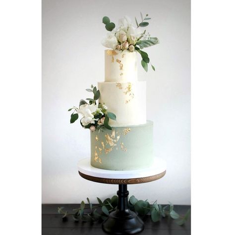 Sage green wedding cake. Buttercream finish with fresh flowers and gold leaf. Wedding Cakes Olive Green, Sage Green Wedding Cake 2 Tier, Sage Green And Gold Wedding Cake, Wedding Cake Sage Green, Sage Green Wedding Cake, Wedding Cake Olive, Cake With White Flowers, Wedding Cake Gold Leaf, Wedding Sage Green