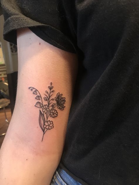 lily of the valley, larkspur and chrysanthemum arm tattoo. Tattoo Lily, Lily Of The Valley Tattoo, Larkspur Tattoo, Marigold Tattoo, Lily Valley, Water Lily Tattoos, Valley Tattoo, Lotr Tattoo, Lady Bug Tattoo