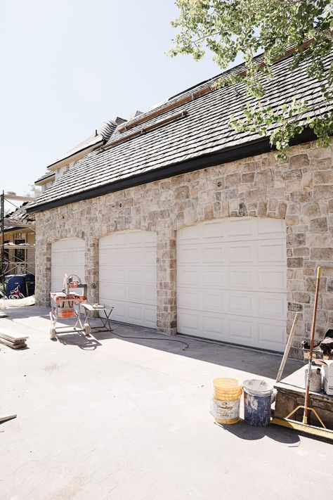 The Stone is Done on our Exterior! - Chris Loves Julia Cobble Stone House Exterior, White And Stone House Exterior Farmhouse, Craft Orchard Limestone Timberwolf, Stone Around Garage Doors, Overgrouted Exterior Stone, Cobblestone Home Exterior, Cottage Exterior Stone, Stone Garage Ideas, Over Grout Stone Exterior