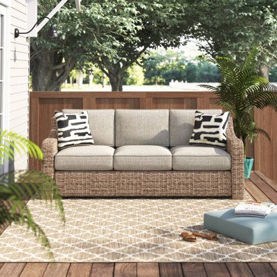 Sporting an easy-on-the-eyes look inspired by driftwood, this sofa is the perfect pick for your patio or deck! Founded atop a powder-coated aluminum frame wrapped in all-weather resin wicker, this sofa is topped off with plush and inviting, removable beige cushions wrapped in weatherproof and stain- and fade-resistant fabric that’s a breeze to keep clean. This is assembled in the USA with global components. | Beachcrest Home™ Danny 82.75" Wide Wicker Patio Sofa w/ Cushions Wicker/Rattan in Brown 3 Seater Outdoor Sofa, Outdoor L Shaped Couch, Hawaii Condo, Outdoor Patio Sofa, Sofa With Cushions, Rockaway Beach, Cozy Outdoor, Outdoor Couch, Boat Stuff