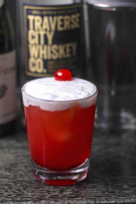 Cherry Whiskey Sour Recipe (Smooth & Tart!) Whiskey Cherries, Cherry Whiskey Sour, Gin Mixers, Cherry Whiskey, Whiskey Sour Recipe, Alcoholic Drink Recipes, Whiskey Recipes, Cherry Cocktail, Maraschino Cherries