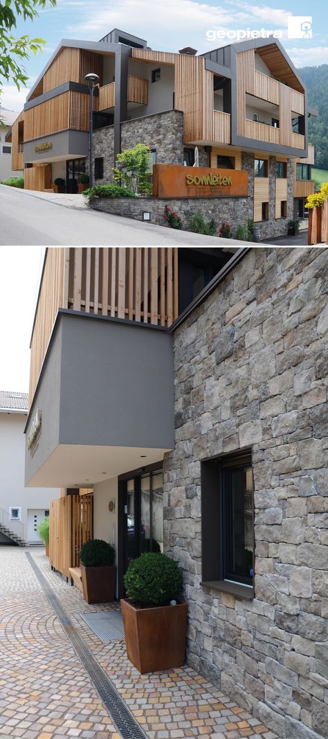 The Sonnleiten Hotel call the attention thanks to Larch wood used in its facade, oxidized sheet metal and Badia model wall stones, that fits naturally within these warm and darker tones of the architecture. The BADIA stone model was skillfully installed using a dry technique, and the materials used give the facility a smart, modern yet traditional look, always maintaining the typical aspect of the alpine areas. #facade #traumhaus #rivestimentoinpietra #stoneveneer #maisonenpierre Concrete Wood Facade, Elevation Materials Architecture, Stone And Wood Facade, Boutique Hotel Facade, Concrete Architecture Facade, Natural Stone Facade, Mass Housing, Restaurant Exterior Design, Hotel Design Architecture