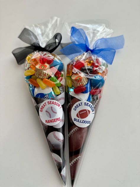 These Sports Candy Cones are perfect for after the game treat, end of the season treat and even for birthday party favors! Be extra and give these custom treats to your sports team and friends. Label can be customized to your teams name or any saying you would like. ✓ Candy Cones ✓ Custom Stickers ✓ ABOUT * Candy Cones with sport design *Wrapped in clear wrapper and tied with a ribbon. * Freshly made * Great party favors and treats. Candy included * 1 Sucker * Skittles * Gummy Savers/Gummy Bears Baseball End Of Season Party, Goodie Bag Items, Custom Treats, Candy Kabobs, 2nd Birthday Party For Boys, Candy Cone, Mike And Ike, Candy Party Favors, Birthday Candy