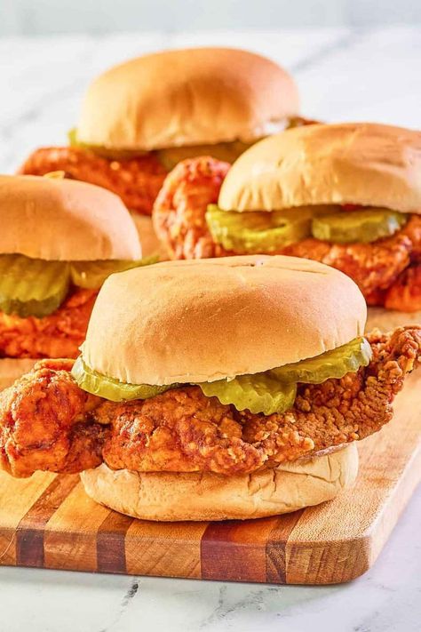 Wingstop Buffalo Chicken Sandwich is a tasty meal. Get the easy copycat recipe and find out how to make the best Buffalo chicken sandwich. Chicken breast is breaded with seasoned flour and buttermilk, fried until crispy, coated with homemade Frank’s Red Hot Buffalo sauce, and placed in a toasted bun with dill pickle slices. Breaded Buffalo Chicken Sandwich, Homemade Buffalo Chicken Sandwich, Buffalo Chicken Sandwich Recipes, Fried Buffalo Chicken Sandwich, Crispy Buffalo Chicken Sandwich, Ground Beef And Beans, Chili With Ground Beef, Restaurant Hacks, Buffalo Chicken Sandwich