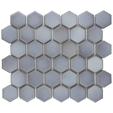 As a modern, enlarged deviation from the classic hexagon mosaic, our Hudson Due Hex 2 in. Grey 11 in. x 12 in. Porcelain Floor and Wall Mosaic Tile instantly elevates spaces through a refreshing dose of geometric design. Featuring a reactive glaze with an eye-drop effect, these tiles have hues of grey that blend to taupe around the edges. This porcelain mosaic floor and wall tile creates a uniquely sporadic design through a pleasing mixture of cool-toned tints with additional dimension added ... Bath Tiles, Merola Tile, Porcelain Mosaic Tile, Marble Mosaic Tiles, Mosaic Wall Tiles, Hexagonal Mosaic, House Tiles, Mosaic Flooring, Natural Stone Tile