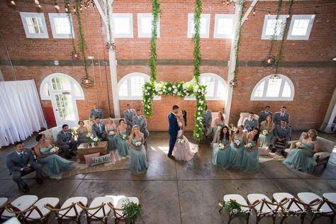 Idea for large bridal party, beautiful wedding ceremony with seated bridesmaids and groomsmen on each side Bridesmaids Sitting During Ceremony, Seated Bridal Party Ceremony, Wedding Party Sitting During Ceremony, Bridal Party Sitting During Ceremony, Large Bridal Party, Beautiful Wedding Ceremony, Large Bridal Parties, Large Wedding, Floral Arrangements Wedding