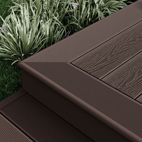 All of our composite decking boards are backed up with an extensive range of colour matching accessories to help you complete your project. Dark Decking Ideas, Dark Grey Decking, Composite Decking Pathway, Composite Decking Pool, Charcoal Composite Decking, Dark Brown Composite Decking, Composite Wood Deck, Decking Boards, Fascia Board