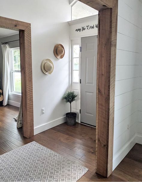 White Baseboards And Wood Trim Windows, Barnwood Door Trim, Interior Home Trim Ideas, Wood Door Casing Ideas, Hallway Casing Ideas, Wood Trimmed Doorway, Wood Trim With Wood Floors, Wood Frame Doorway, Small Farm House Renovations