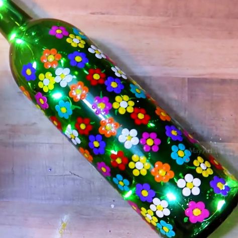 Fun and easy Q-tip bottle painting! | bottle, art of painting | Fun and easy Q-tip bottle painting! | By MetDaan DIY Metdaan Diy, Q Tips, Senior Crafts, Q Tip Painting, Library Crafts, Art Of Painting, Flowers Wine, Hand Painted Wine Bottles, Christmas Crafts To Sell