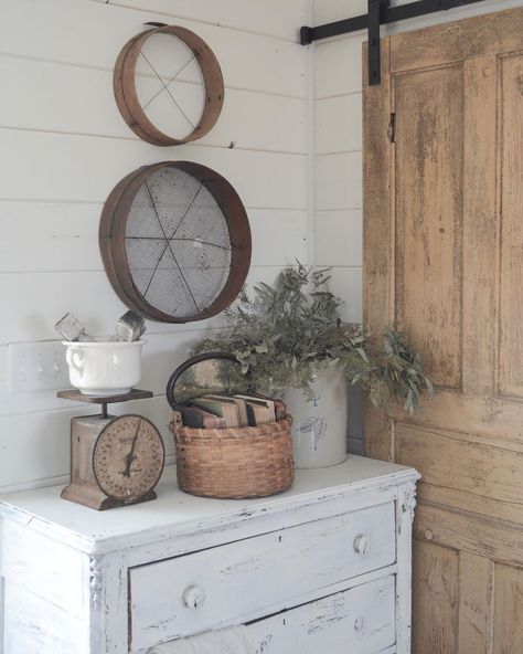 kayla 🌿 our sweet farmhouse on Instagram: “Big rusty scales and antique sifters, old woven baskets and dried eucalyptus, chippy white dressers topped with antiques These are a few of…” Farmhouse Basket Walls, Sifter Decor, Farmhouse Antique Decor, Basket Walls, Old Door Projects, White Dressers, Top Of Dresser, Farmhouse Basket, Farmhouse Fixer Upper