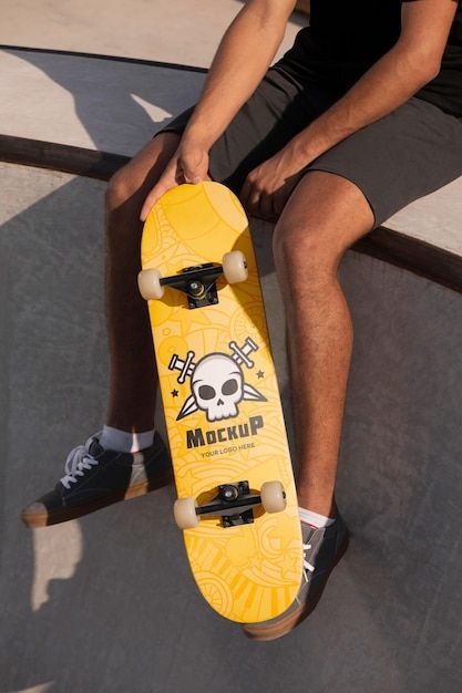 Young man holding a mock-up skateboard | Free Psd #Freepik #freepsd #skateboard-mockup #cool-guy #cool-man #guy Flame Design, Free Psd, Mock Up, Mockup, Skateboard