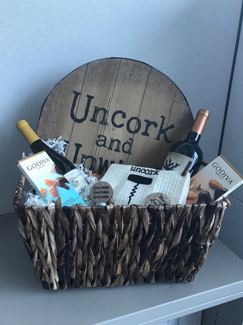 Uncork and Unwind gift basket of wine and chocolate. Perfect for wine lovers! #winegift #DIYgifts Wine And Coffee Gift Basket, Thank You Wine Basket, Wine Baskets For Raffles Fundraisers, Thank You Wine Gift Basket Ideas, Alcohol Gift Basket For Men, Wine Night Gift Basket, Cricut Raffle Basket Ideas, Beef And Beer Basket Ideas, Wine Lover Gift Basket