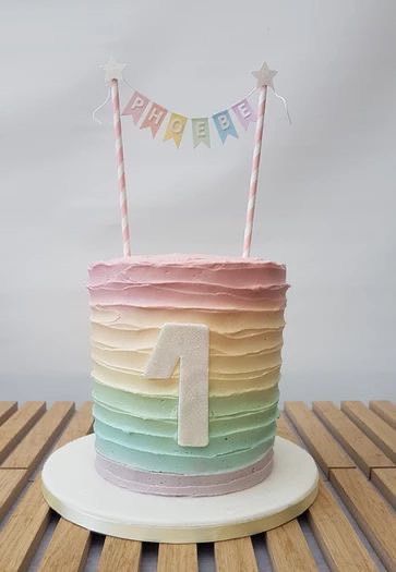 Pastel Rainbow Buttercream Cake, Pastel Rainbow Birthday Theme, Pastel Colored Cake, Pastel 1st Birthday Cake, Kids Rainbow Cake, Cakes Pastel Colors, Rainbow Cake First Birthday, 1st Birthday Cake Rainbow, Pastel 1st Birthday Girl