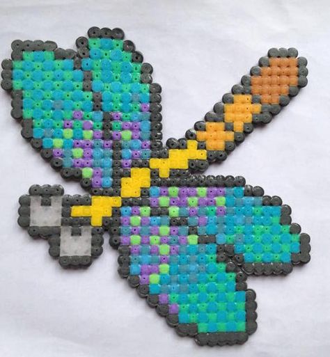 Made a dragonfly for my mum - Imgur Perler Bead Dragonfly, Dragonfly Perler Bead Pattern, Melted Pony Beads, Hama Beads Pattern, Hama Art, Beaded Dragonfly, Pearl Beads Pattern, Sensory Crafts, Fuse Bead Patterns