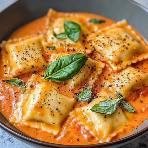 ￼

Creamy Tomato Ravioli Sauce

Ingredients:
2 tablespoons olive oil
3 cloves garlic, minced
1 can (14.5 oz) diced tomatoes (or 2 cups fresh tomatoes, diced)
1 cup heavy cream
1 teaspoon Italian seasoning
1/2 teaspoon red pepper flakes (optional for heat)
Salt and pepper to taste
1/2 cup grated Parmesan cheese
Fresh basil leaves, for garnish
Instructions:
Sauté Garlic:

In a large skillet, heat the olive oil over medium heat. Add the minced garlic and sauté for about 1 minute until fragrant, being careful not to burn it.
Add Tomatoes:

Add the diced tomatoes (with their juices) to the skillet. Stir and cook for about 5 minutes, allowing the flavors to meld.
Incorporate Cream:

Reduce the heat to low and pour in the heavy cream. Stir well to combine, then add the Italian seasoning, red pepp Sausage Ravioli Filling Recipe, Creamy Tomato Ravioli, Sausage Ravioli Filling, Tomato Ravioli, Sausage Ravioli, Chicken Ravioli, Ravioli Sauce, Ravioli Filling, Mushroom Ravioli