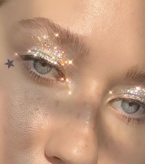 #glitter #makeup #aestheticmakeup #glossier #milkmakeup #milk #tattoostamp #star #egirl #egirlmakeup Star Inspired Makeup, Star Themed Makeup, White Star Makeup Look, Saturn Makeup, Gold Star Makeup, Sun And Moon Eye Makeup, Saturn Makeup Look, Moon Costume Makeup, Star Stamp Makeup