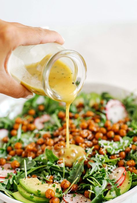 The most delicious Arugula Salad with Honey Roasted Chickpeas that are sweet, savory and perfectly crunchy!  Top with fresh veggies, avocado slices and my lemon dijon herb dressing! Honey Roasted Chickpeas, Herb Dressing Recipe, Salad With Peanut Dressing, Salad Spinach, Herb Dressing, Crunchy Chickpeas, Peanut Dressing, Arugula Salad, Shrimp Salad