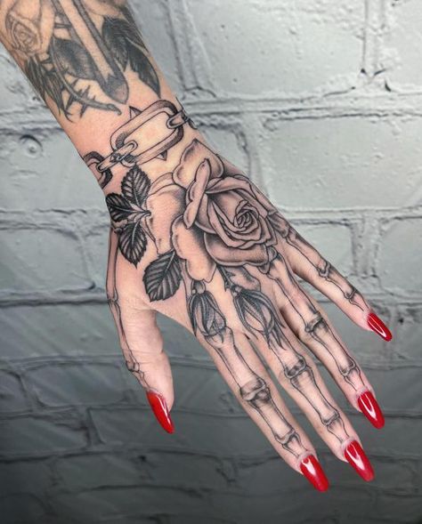 Rose and skeleton hand tattoo with leaves Delicate Flower Hand Tattoos For Women, Skeleton Hand Neck Tattoo, Skeleton Hand Tattoo Stencil, Rose Hand Tattoo Woman, Skeleton Finger Tattoo, Dope Hand Tattoos For Women, Hand Tattoo Ideas Female, Girly Hand Tattoos, Bone Hand Tattoo