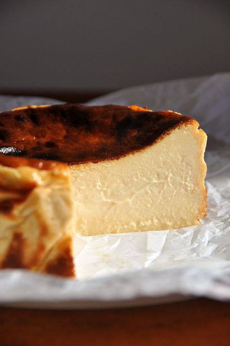 Perfectly creamy and smooth in the center with dark, caramelized edges, burnt Basque cheesecake (also known as San Sebastian cheesecake) is famous for a reason. This small-batch, gluten-free recipe makes a six-inch cake, so you don’t have to commit to pounds of cream cheese. Burnt Basque cheesecake has no crust and doesn’t require a water bath. Just mix all the ingredients and bake briefly at a very high temperature. The hardest part is waiting for it to chill overnight! Serves 6-10. Small Cheesecake Recipes 6 Inch, Small Basque Cheesecake, Small Batch Cream Cheese Desserts, Bask Cheesecake Recipe, 6” Cheesecake Recipe, Cheesecake 6 Inch, Spanish Cheesecake, Gateau Basque Recipe, Small Batch Cake