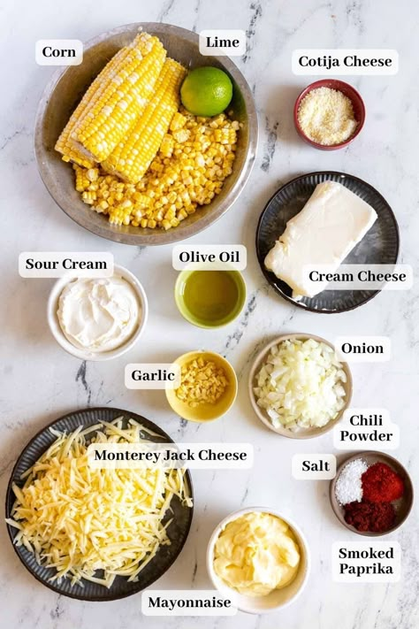 A delicious and unique twist on classic corn dip - elote dip! This baked Mexican corn dip recipe is creamy, savory, and easy to make, it's the perfect appetizer or snack for any occasion. Serve it with tortilla chips and watch it disappear! Mexican Cheese Corn Dip, Mini Elote Cups, Elote Cheese Dip, Elotes Corn Dip, Hot Elote Corn Dip, Mexican Street Corn For A Party, Helotes Mexican Corn, Creamy Elote Dip, Mexican Cream Corn Recipe