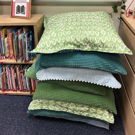 Pillows for dayyyys! These are perfect for low tables. Classroom decor, classroom design, natural classroom, classroom organization, nature themed classroom, calming classroom decor, flexible seating Classroom Theme Nature, Nature Themed Library, Nature Aesthetic Classroom, Granola Classroom, Elementary Classroom Themes Nature, Cottagecore Classroom Theme, Whimsigoth Classroom, Nature Based Classroom Decor, Nature Preschool Classroom Decor