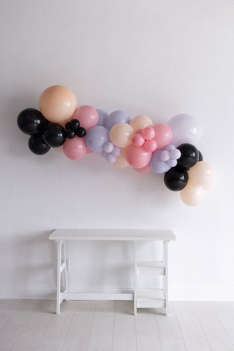 Get ready for a hauntingly fun celebration with our Pastel Spooktacular Garland! Perfect for a playful twist on Halloween decor, this pastel balloon garland brings a soft, whimsical vibe to your 'Here for the Boos' party. Easy to set up and full of spooky charm, it's the ideal way to add a touch of pastel magic to your Halloween festivities. Make your celebration both sweet and spooky with this enchanting garland! Your Grab & Go Balloon Garland includes:- 18", 11", and 5" balloons- Available in 6 ft, 8 ft, or 10 ft. Once balloons have left our premises, we do not offer refunds or replacements. Pink Halloween Balloon Arch, Pink Halloween Balloons, Halloween Grab And Go Balloon Garland, Cute Halloween Balloon Garland, Grab And Go Balloon Garland, Black Ballons, Mini Balloon Garland, Pastel Balloon Garland, Sweet And Spooky